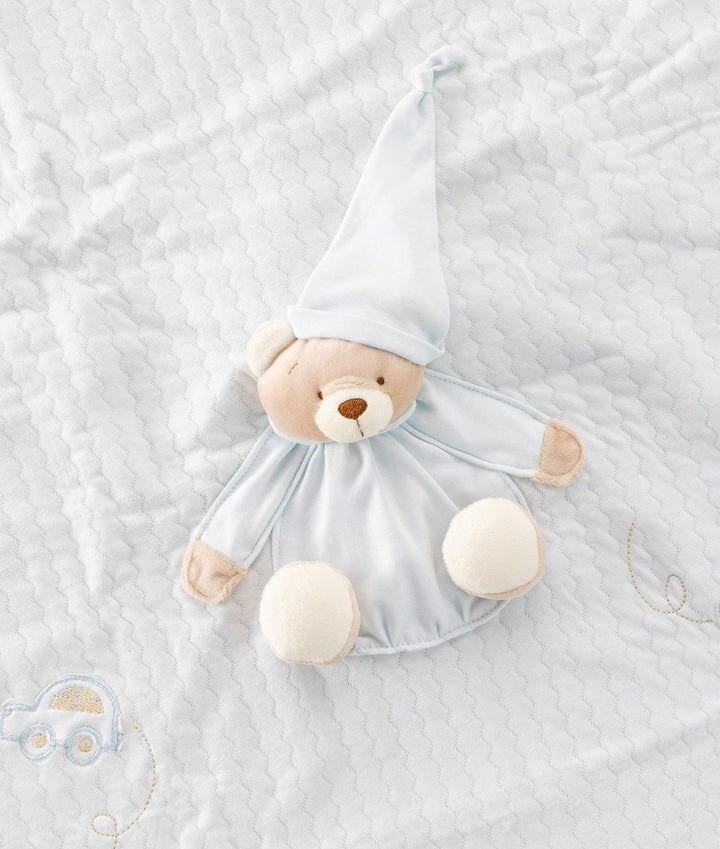 Close-up of light blue baby blanket stitching on 3D bear face and toy car