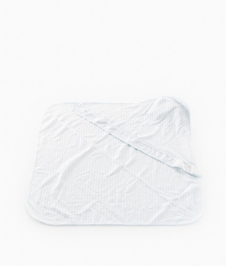 Back view of light blue cotton swaddle showing diamond quilting texture and adjustable fastening strap