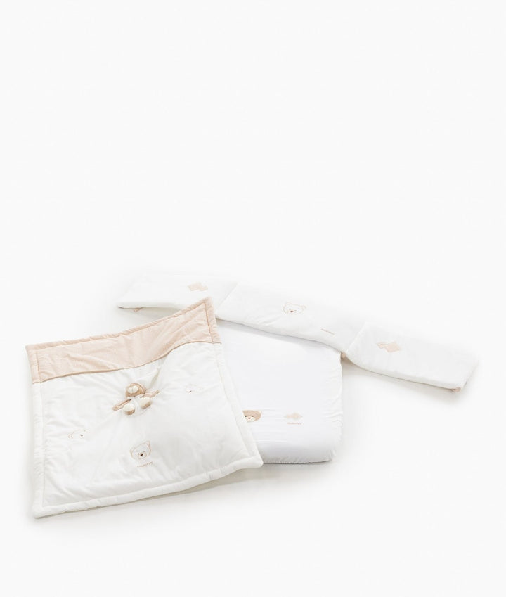 Beige and white 3-piece bassinet bedding set with quilted blanket, bumper, and fitted sheet