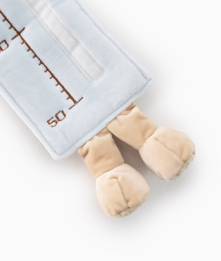 Bottom view of light blue bear growth chart showing beige feet and size 50 mark