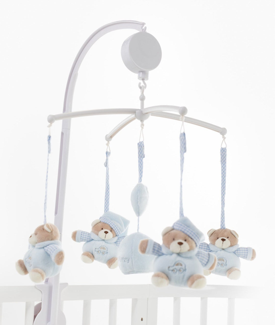 blue bear musical mobile with mirror hanging over white crib