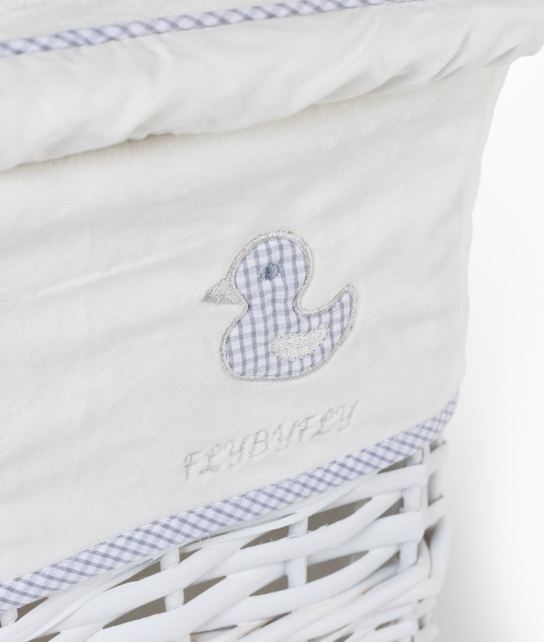 Blue gingham duck patch detail on cream fabric liner with FLYBYFLY embroidery and checkered trim