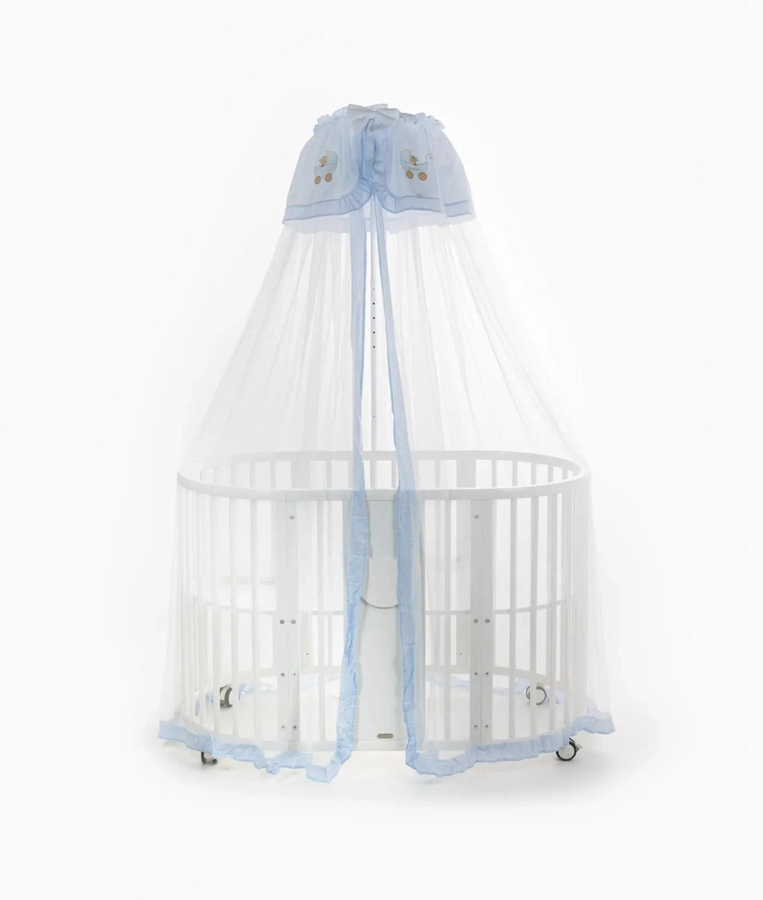 Front view of white oval cot with sheer blue and white canopy draped open to reveal interior and central support stand