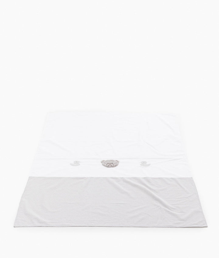 White cotton flat sheet with grey gingham border and central plush teddy bear design