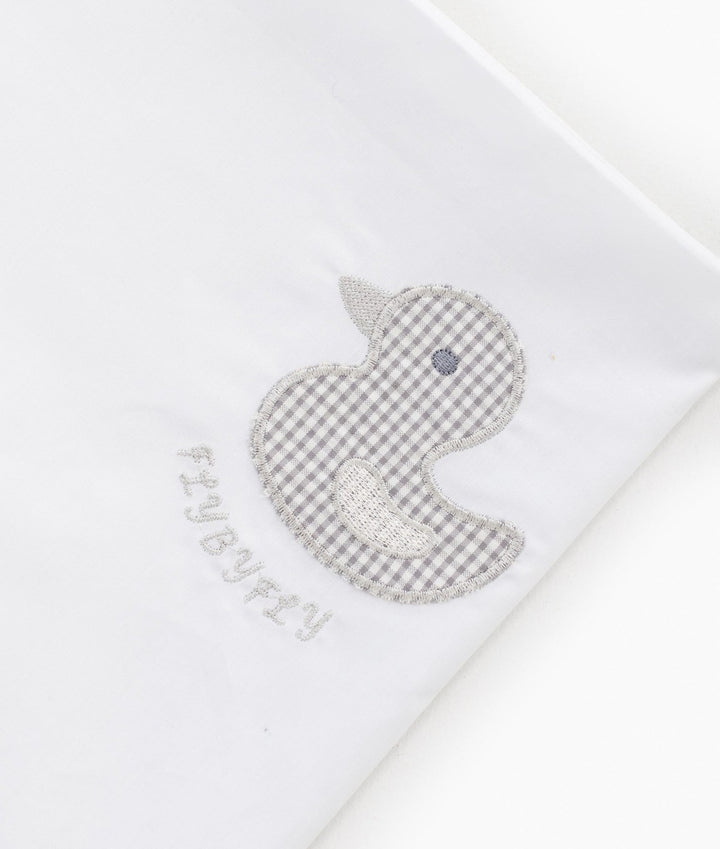 Grey gingham duck applique detail on white cotton flat sheet with FLYBYFLY logo
