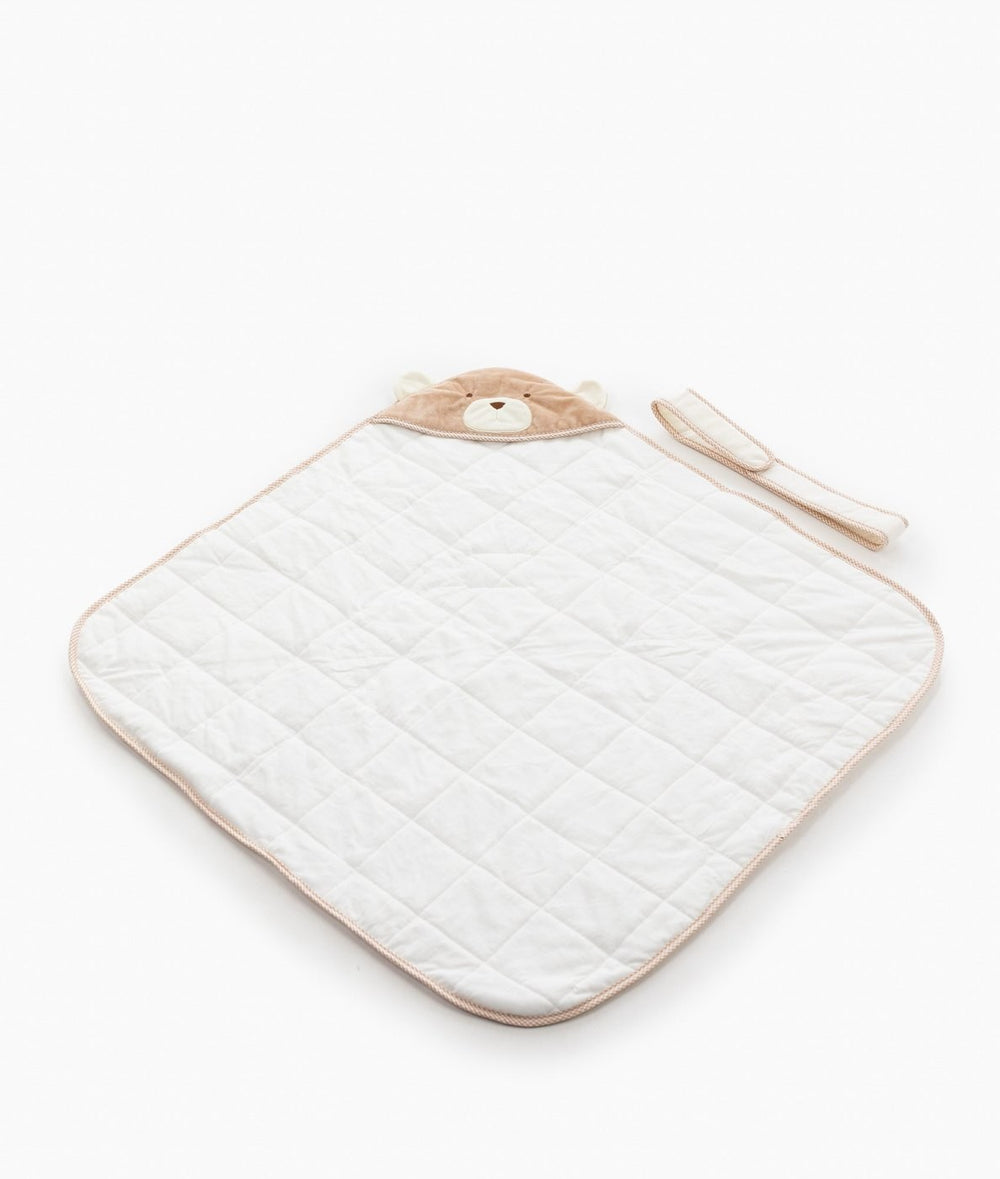 Beige and white hooded baby swaddle with diamond quilted cotton texture