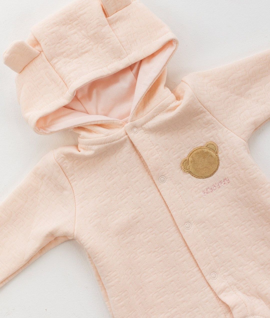Pale pink hooded romper with bear ear hood and front snap button placket