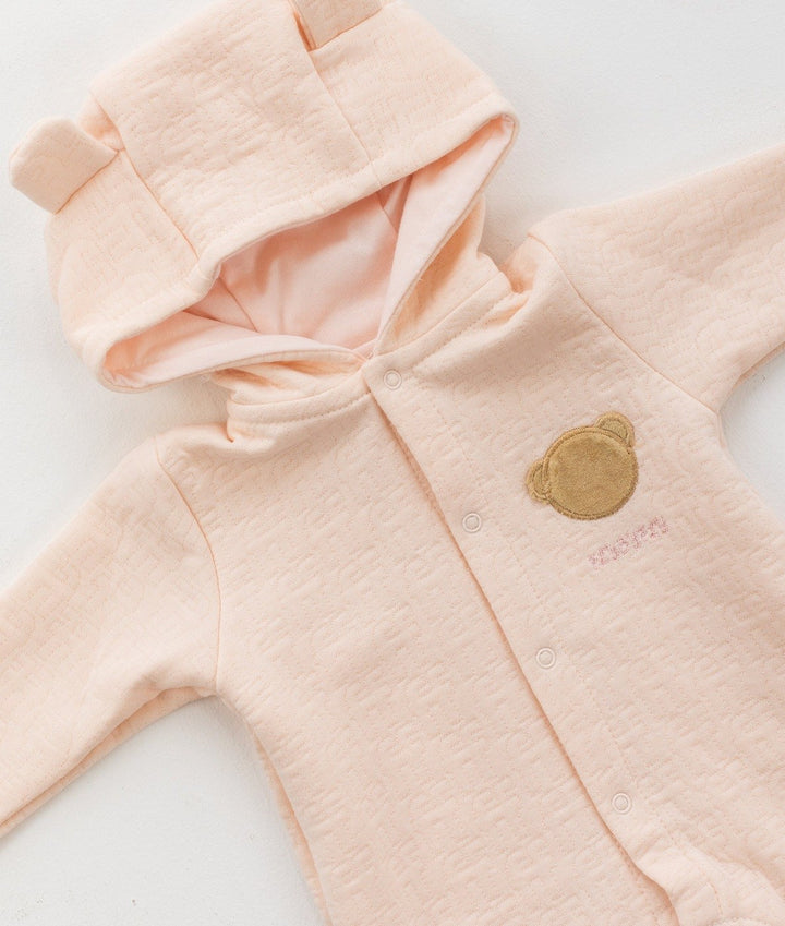 Pale pink hooded romper with bear ear hood and front snap button placket