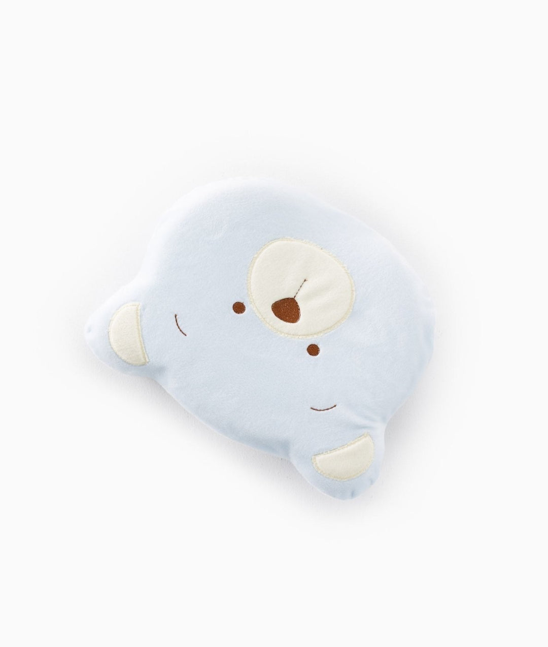 Side view of light blue memory foam baby pillow with cream inner ears and brown embroidered facial features