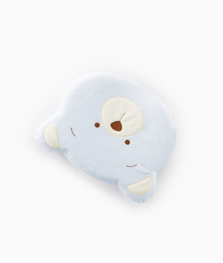 Side view of light blue memory foam baby pillow with cream inner ears and brown embroidered facial features