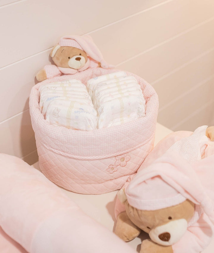 Pink quilted round cot liner basket with embroidered flowers and teddy bears