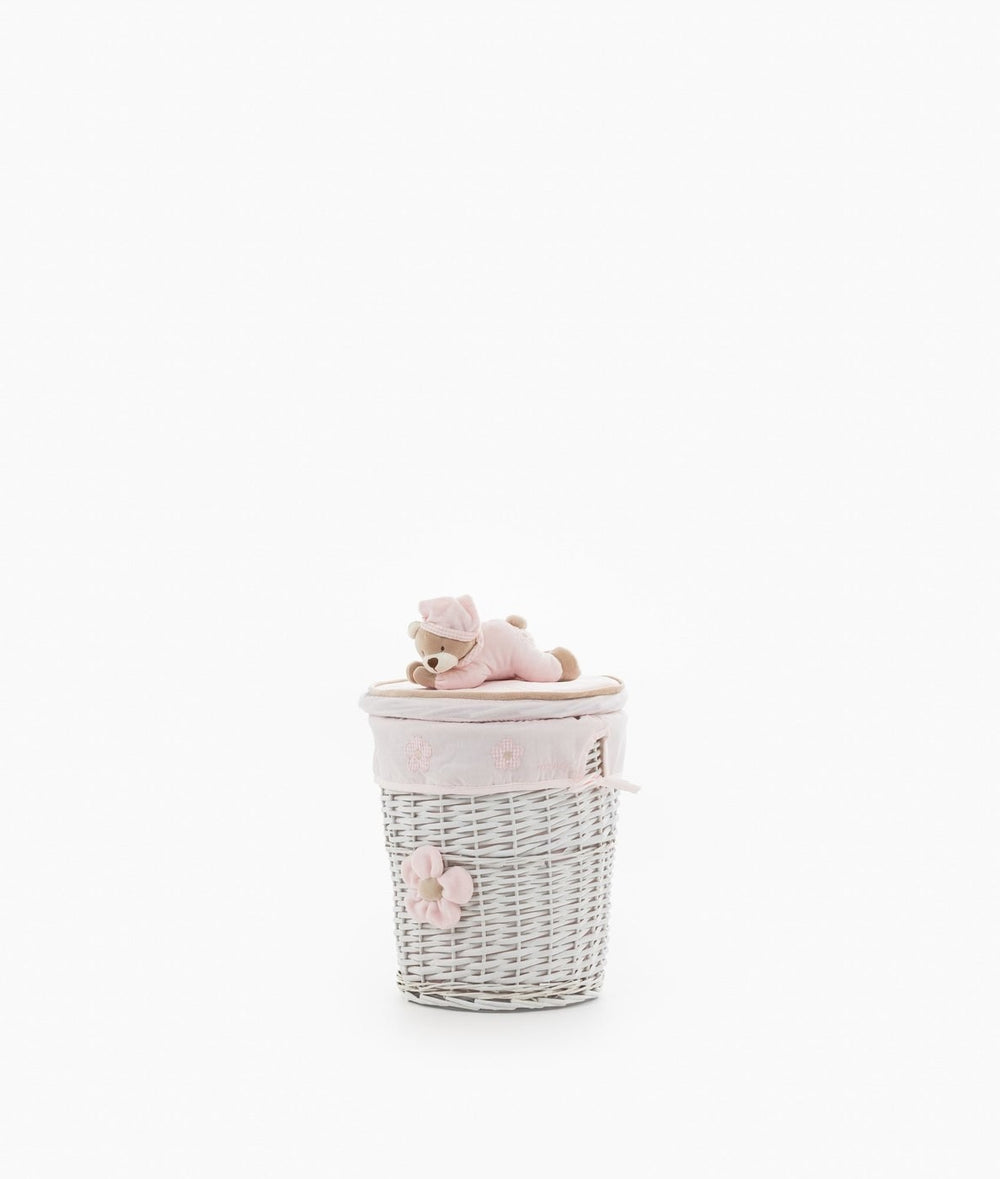 Small round white wicker bin with pink flower detail and teddy bear lid