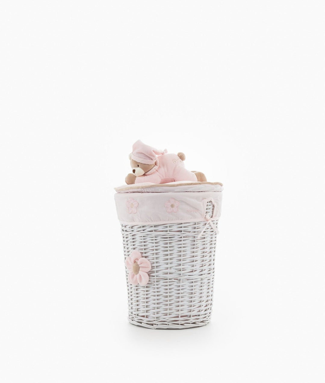 Full shot of white wicker storage basket with pink flower and teddy bear