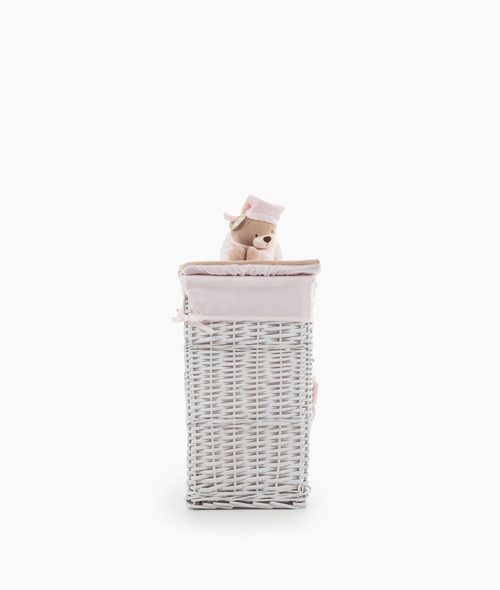 Tall woven wicker basket with pink fabric lid and brown teddy bear