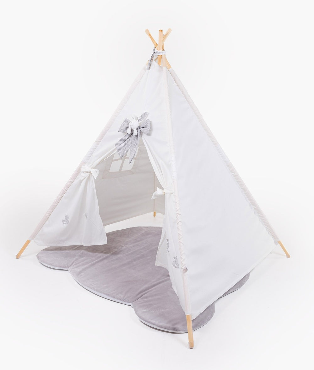 White teepee tent styled with plush grey cloud floor mat and embroidered duck motifs