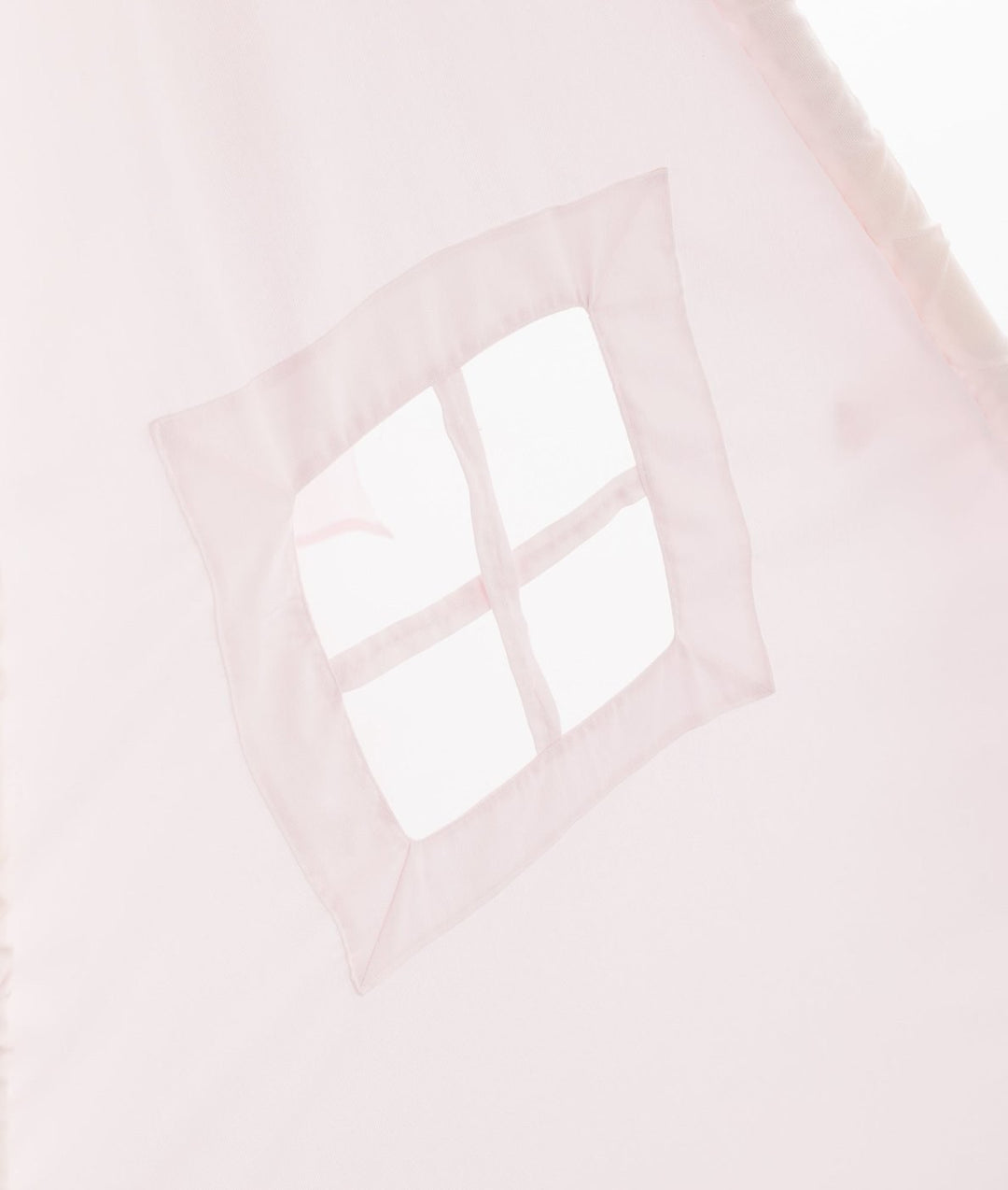 Diamond-shaped window opening on pink teepee with crossbar dividers