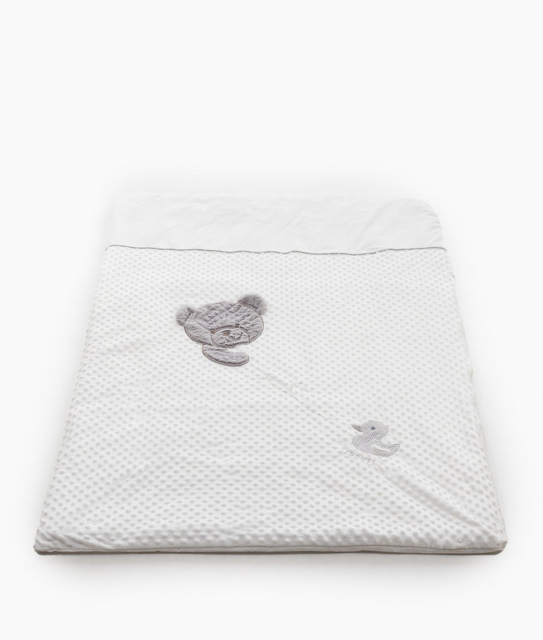 White dotted bubble quilt cover with grey piped trim and appliqué