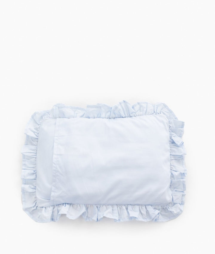 Back side of light blue cotton pillowcase with continuous gathered ruffle trim around perimeter and plain smooth fabric surface