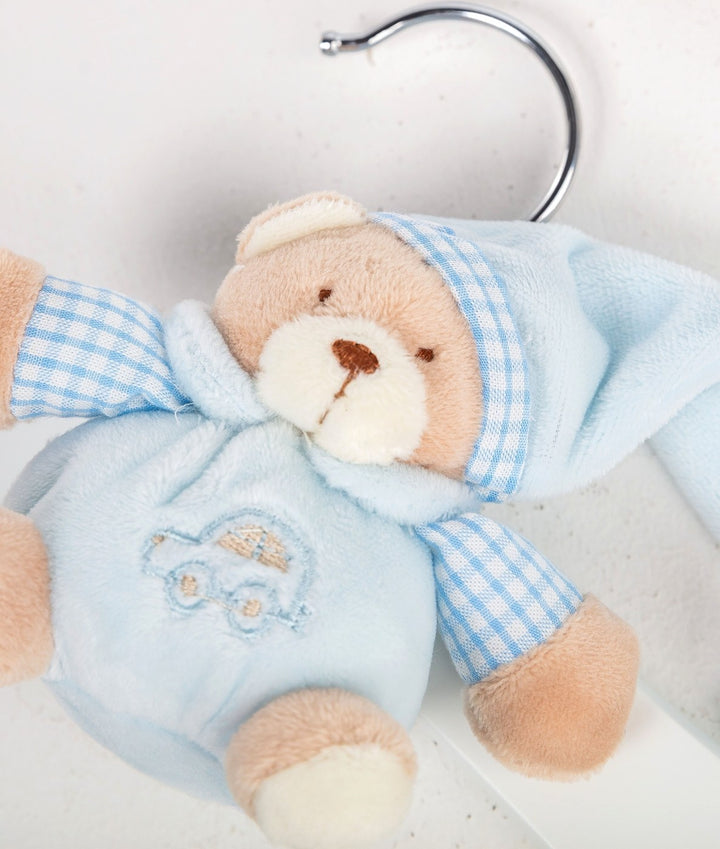Close-up of blue plush teddy bear hanger wearing gingham hooded onesie