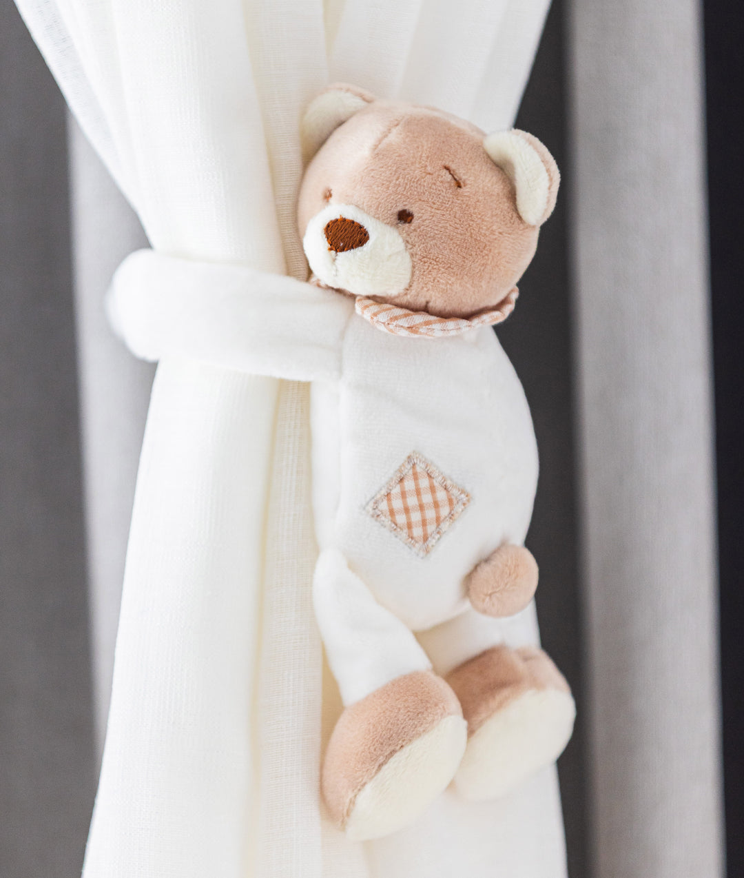 Beige and white bear curtain tieback for nursery
